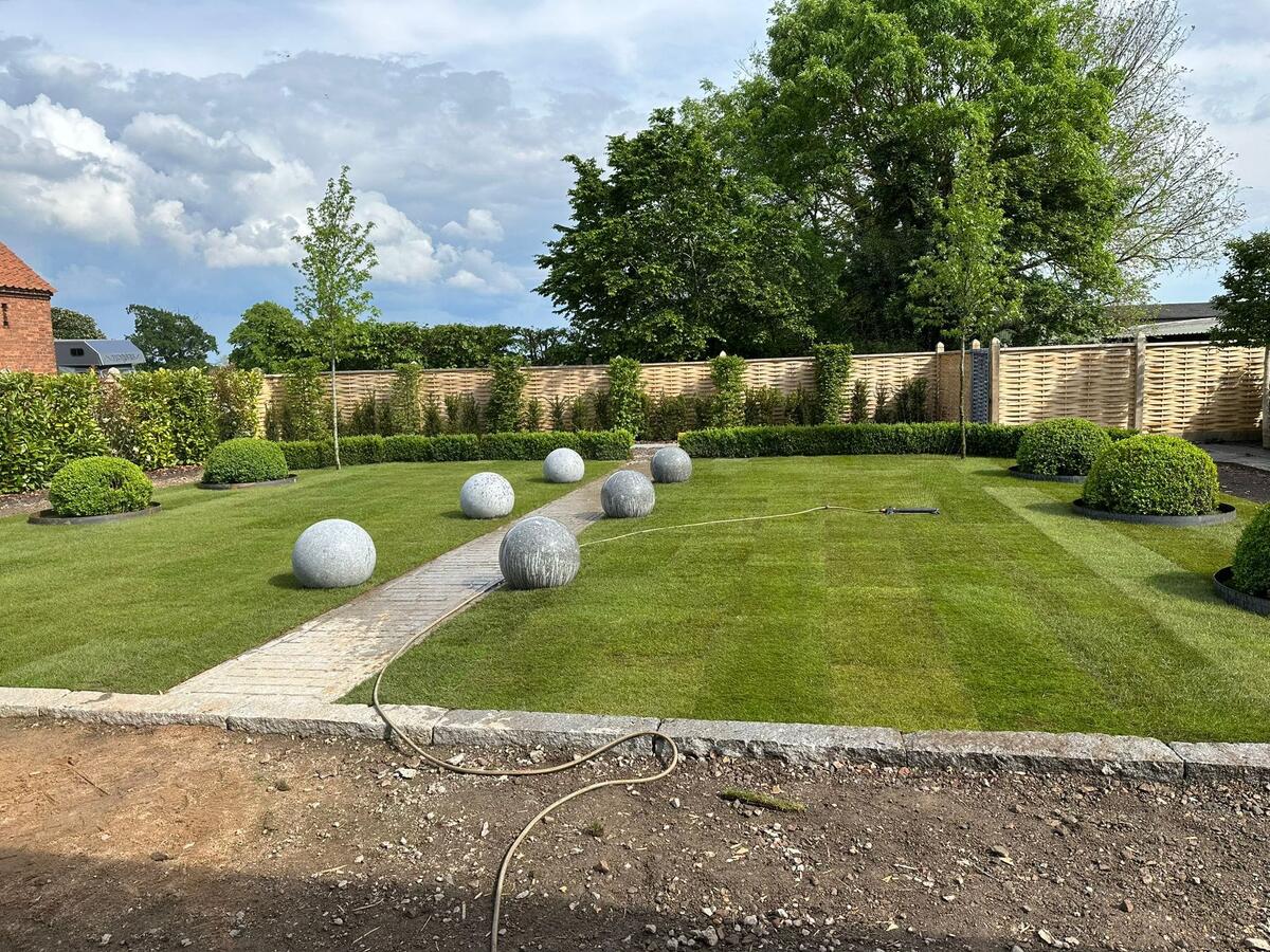 Granite Spheres bordering a garden path