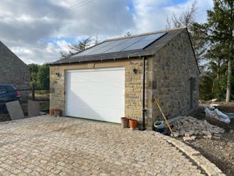 Golden brown granite sett driveway