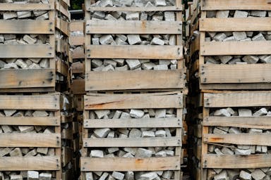 Stacked one-tonne crates of granite setts