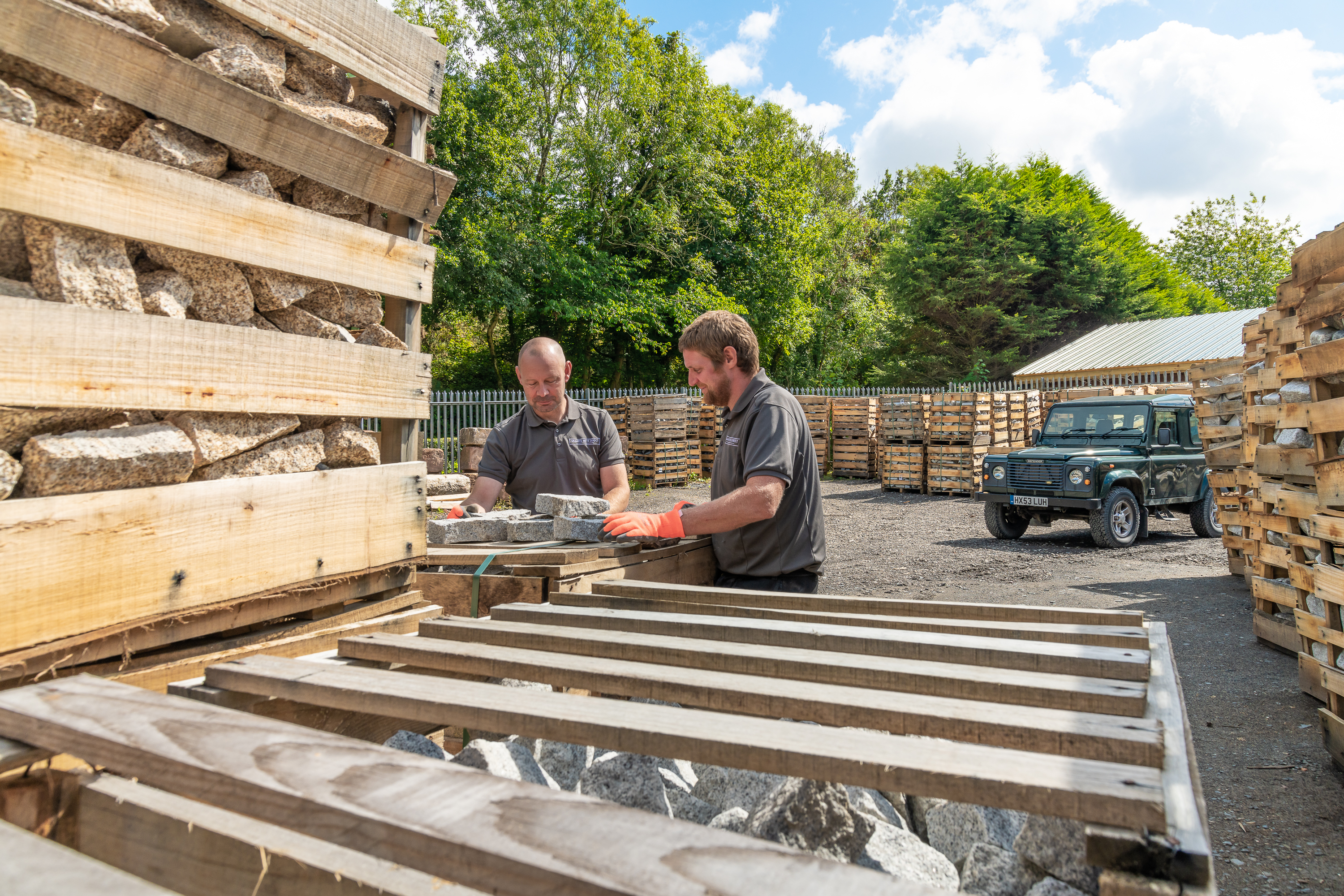 Michael and Iain prepare a crate of Medium Grey Granite Setts