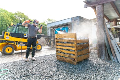 Michael jet-washing freshly cropped cobbles