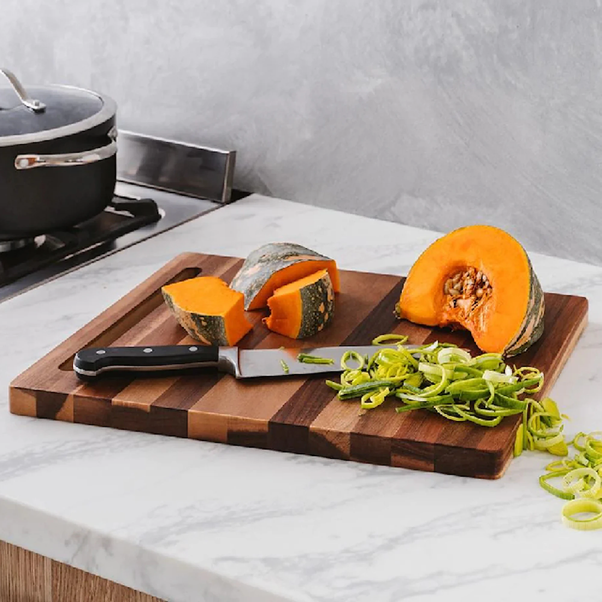 Baccarat Cutting board with pumpkin and a knife laying on it