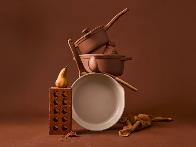 Baccarat NOOK terracotta cookware stacked with terracotta bricks