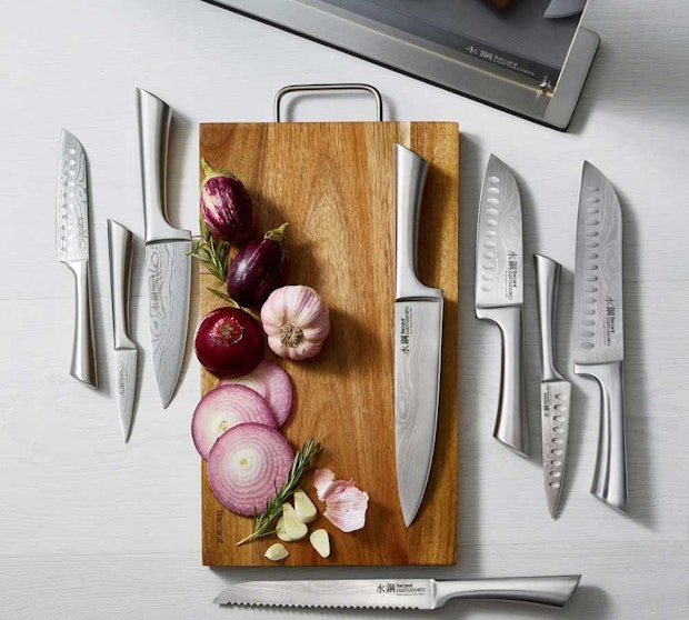 Baccarat Knives. Flat lay of assorted Japanese steel knives