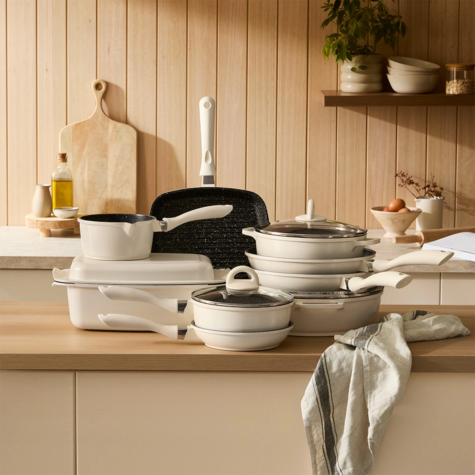 Baccarat STONE 10-piece cookware set in cream on a kitchen bench