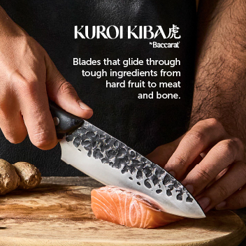 Chef cutting salmon with Kuroi Kiba knife
