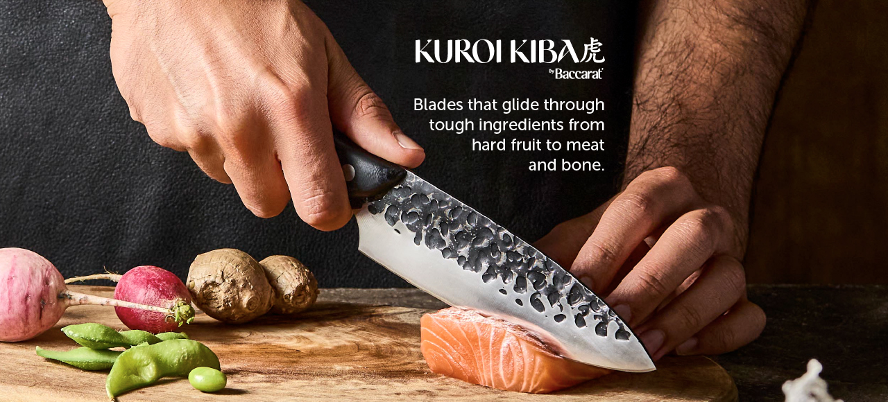 Chef cutting salmon with Kuroi Kiba knife