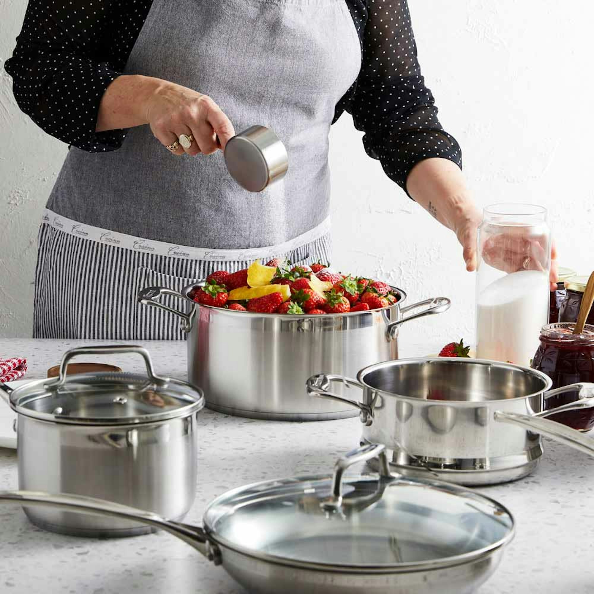 Top Reasons to Invest Quality Cookware blog. Woman making jam using Baccarat stainless steel cookware set