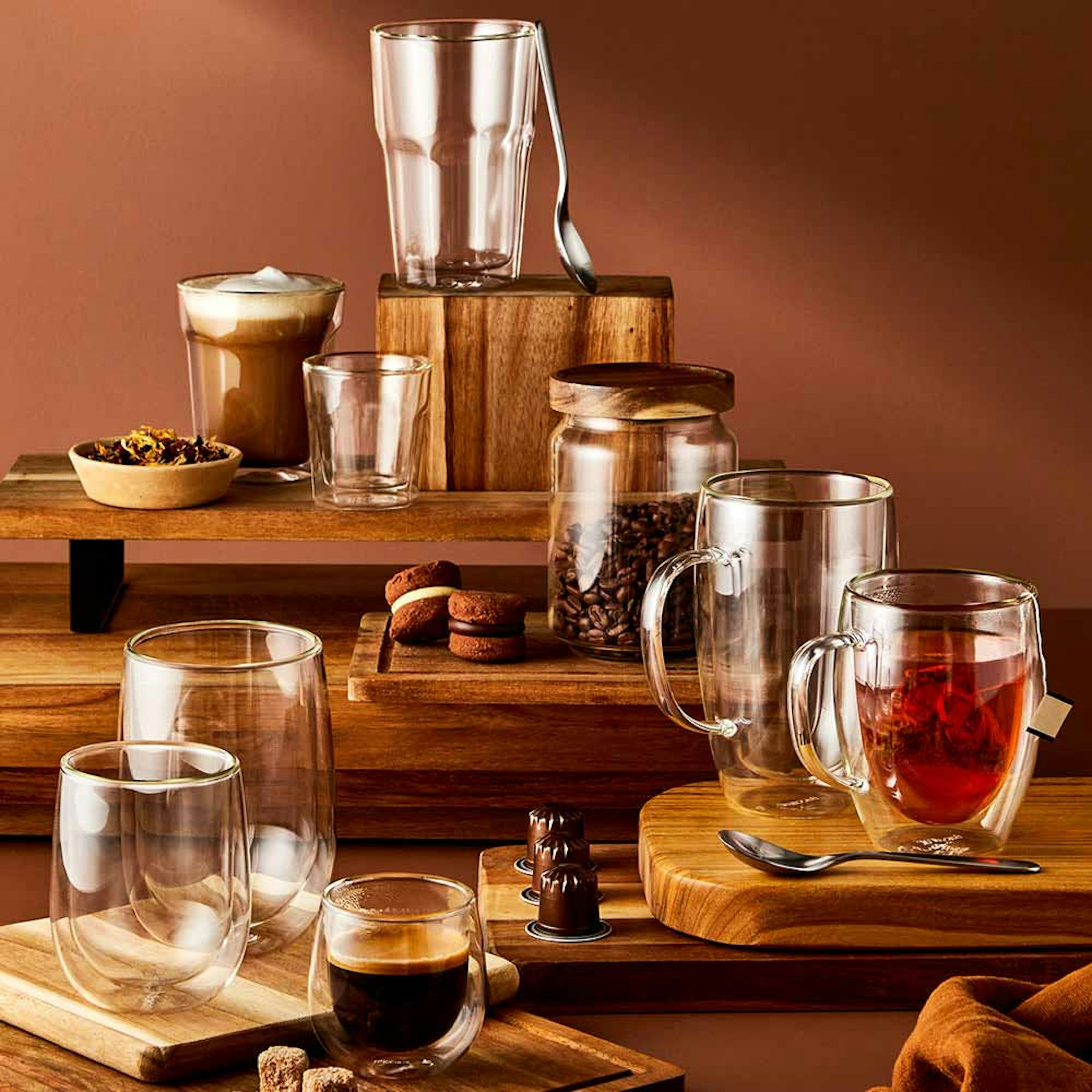 different sized glass cups & mugs on a tiered stand - Baccarat
