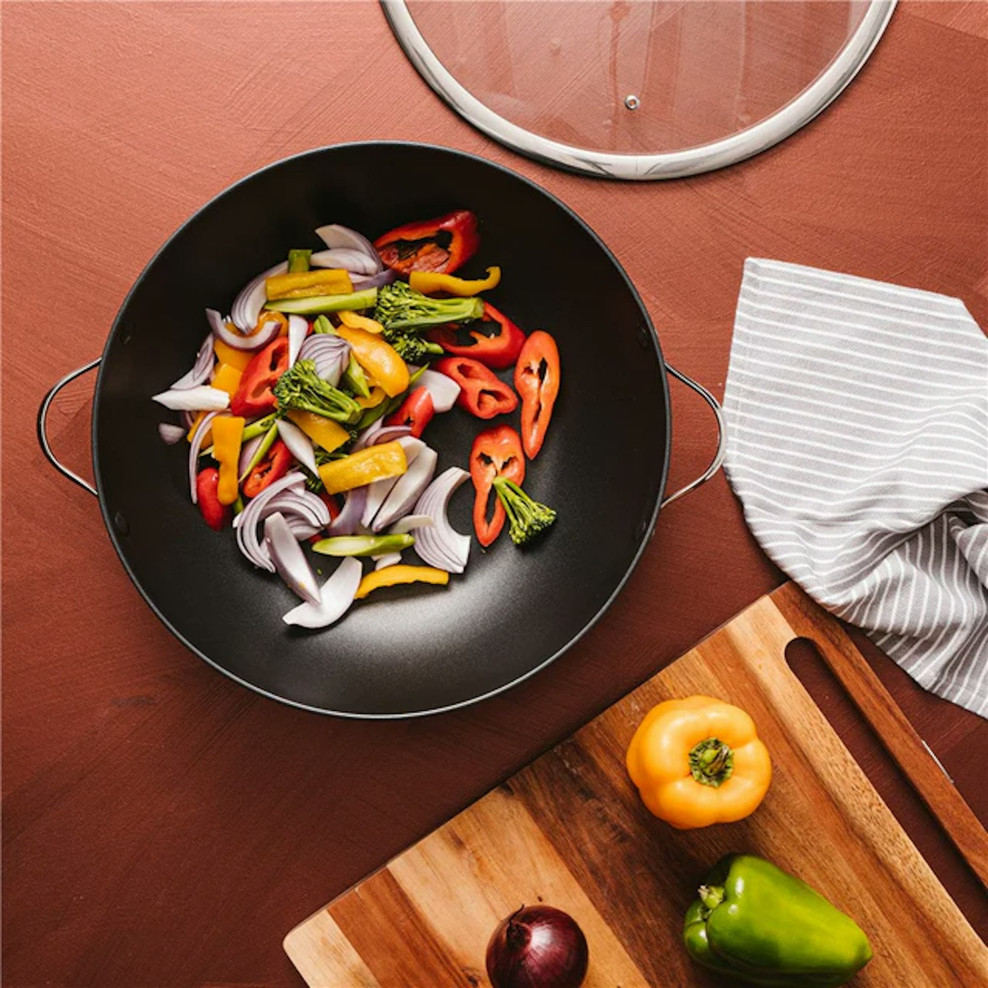 Wok with vegetables placed in it