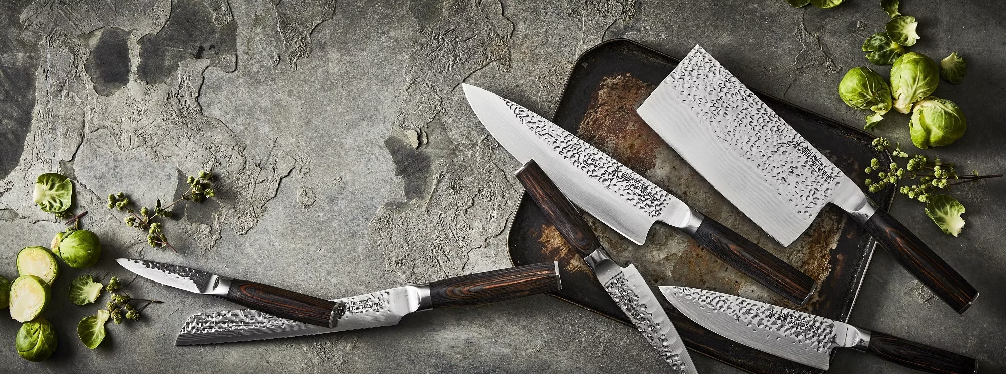 kitchen knives littered across a kitchen bench
