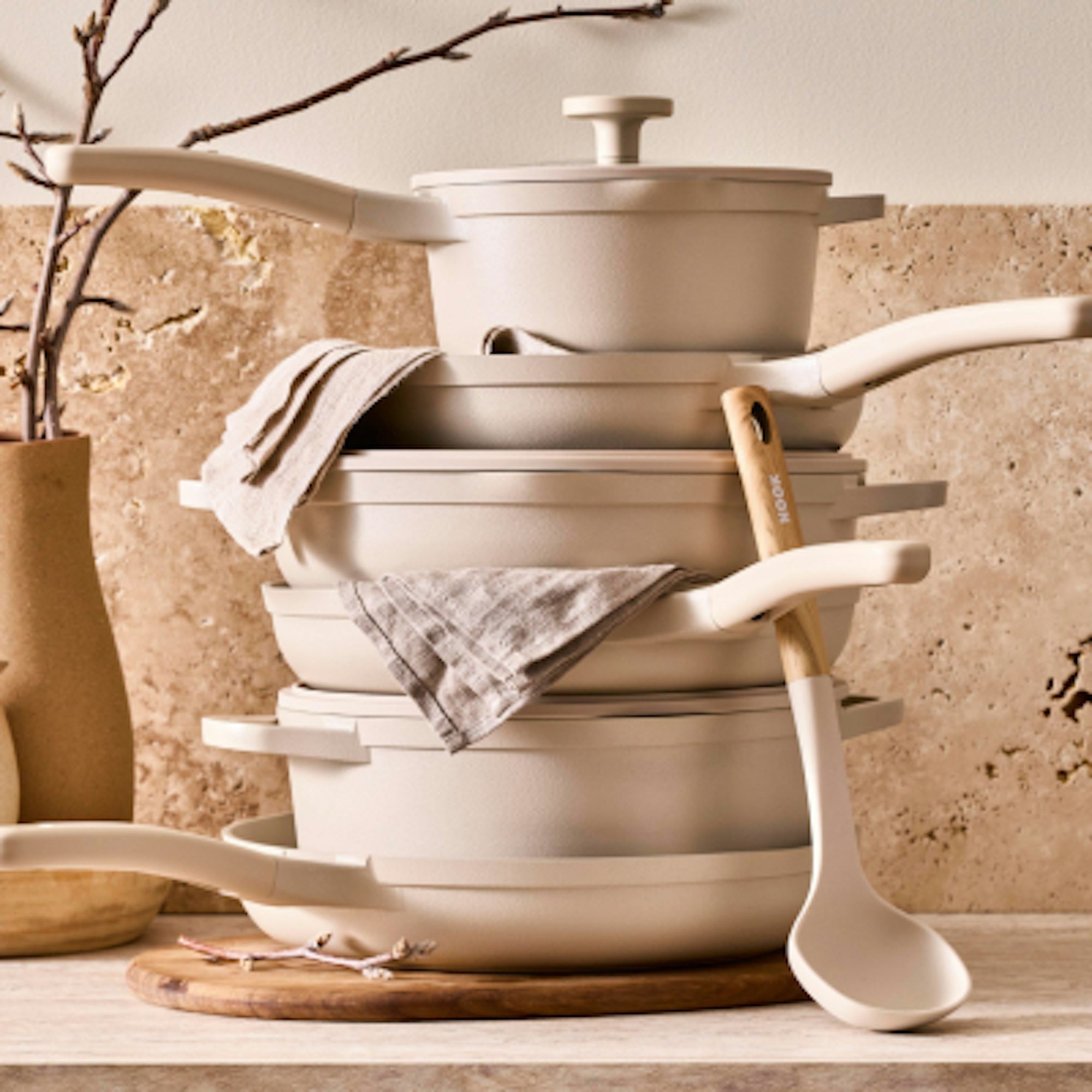 NOOK cream cookware in a stack