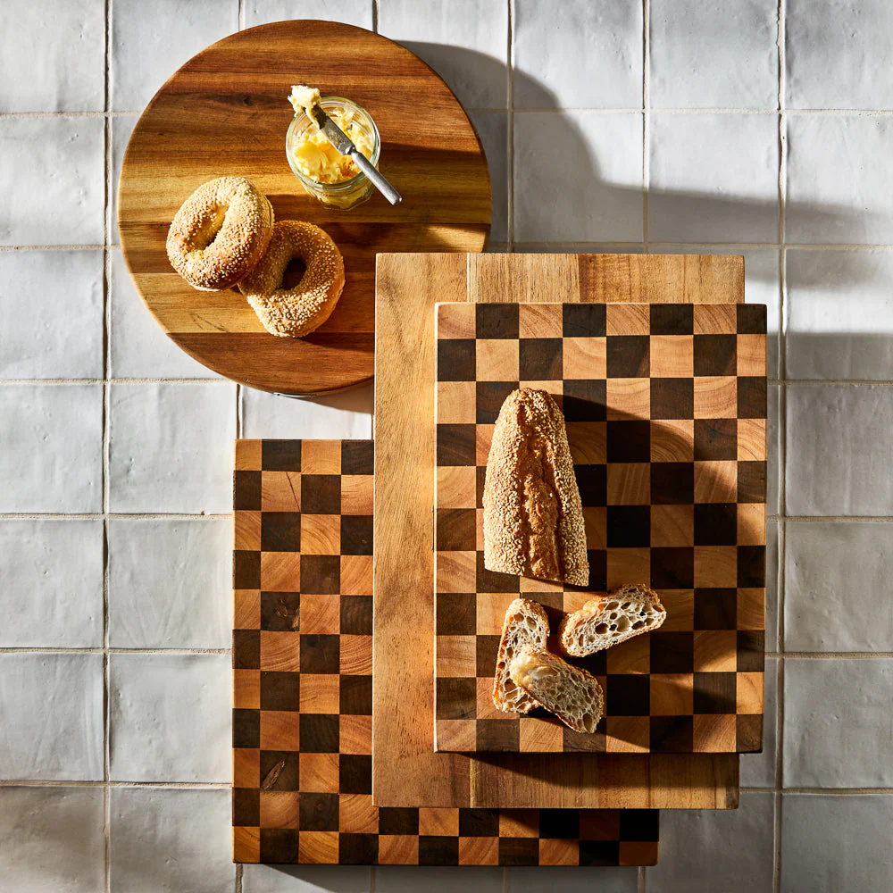 Serving boards with bagels and bread on them