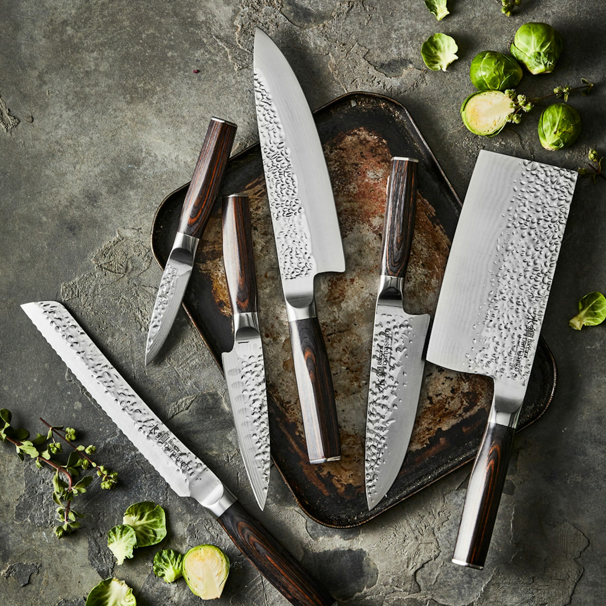 Bunching of Japanese style knives on display on a kitchen table