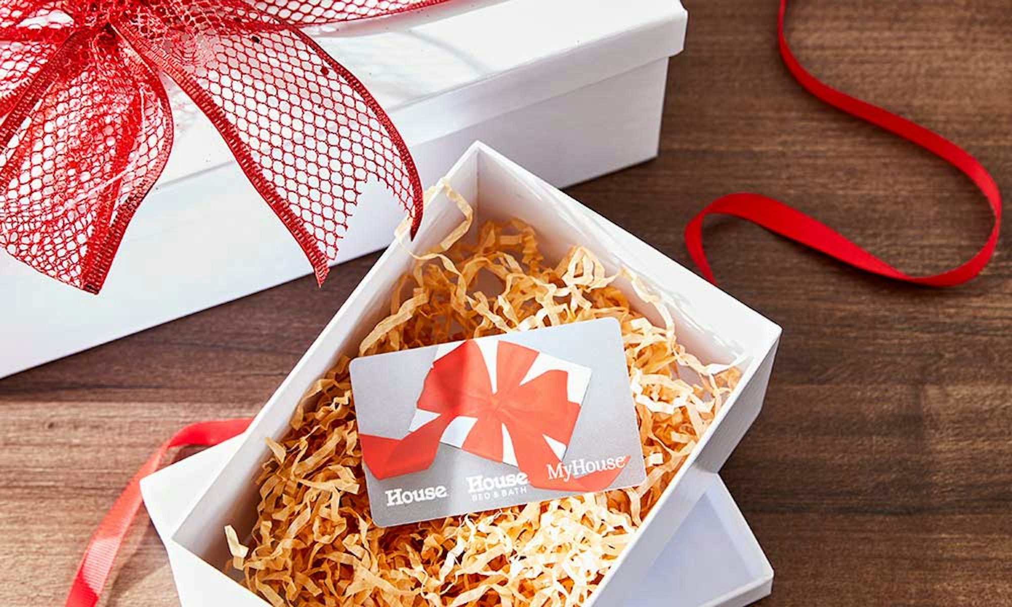 Christmas Gift Guide 2023. Gift Cards. Last minute gifts. Gift card in white box with red ribbon.