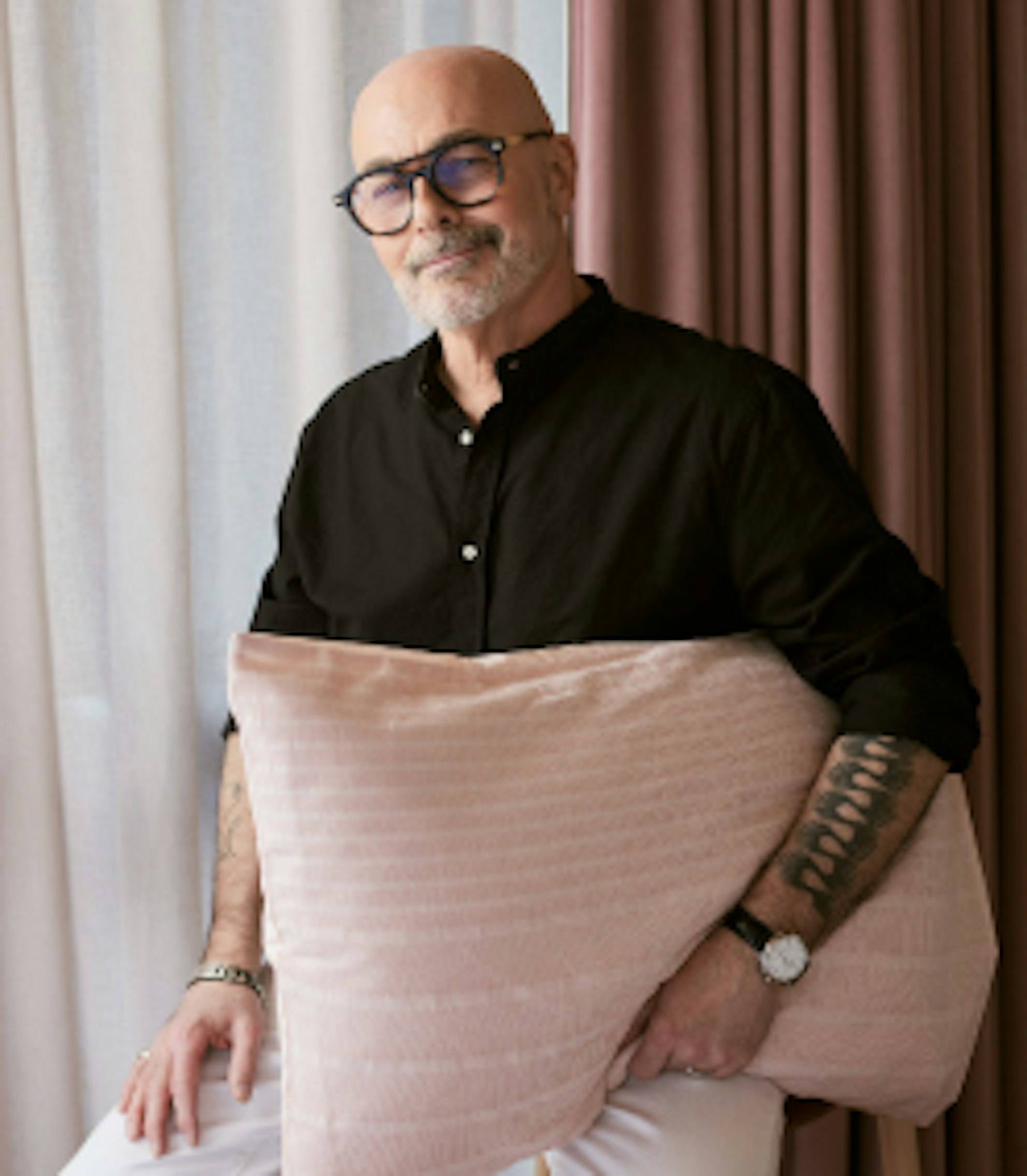 Neale holding a pillow