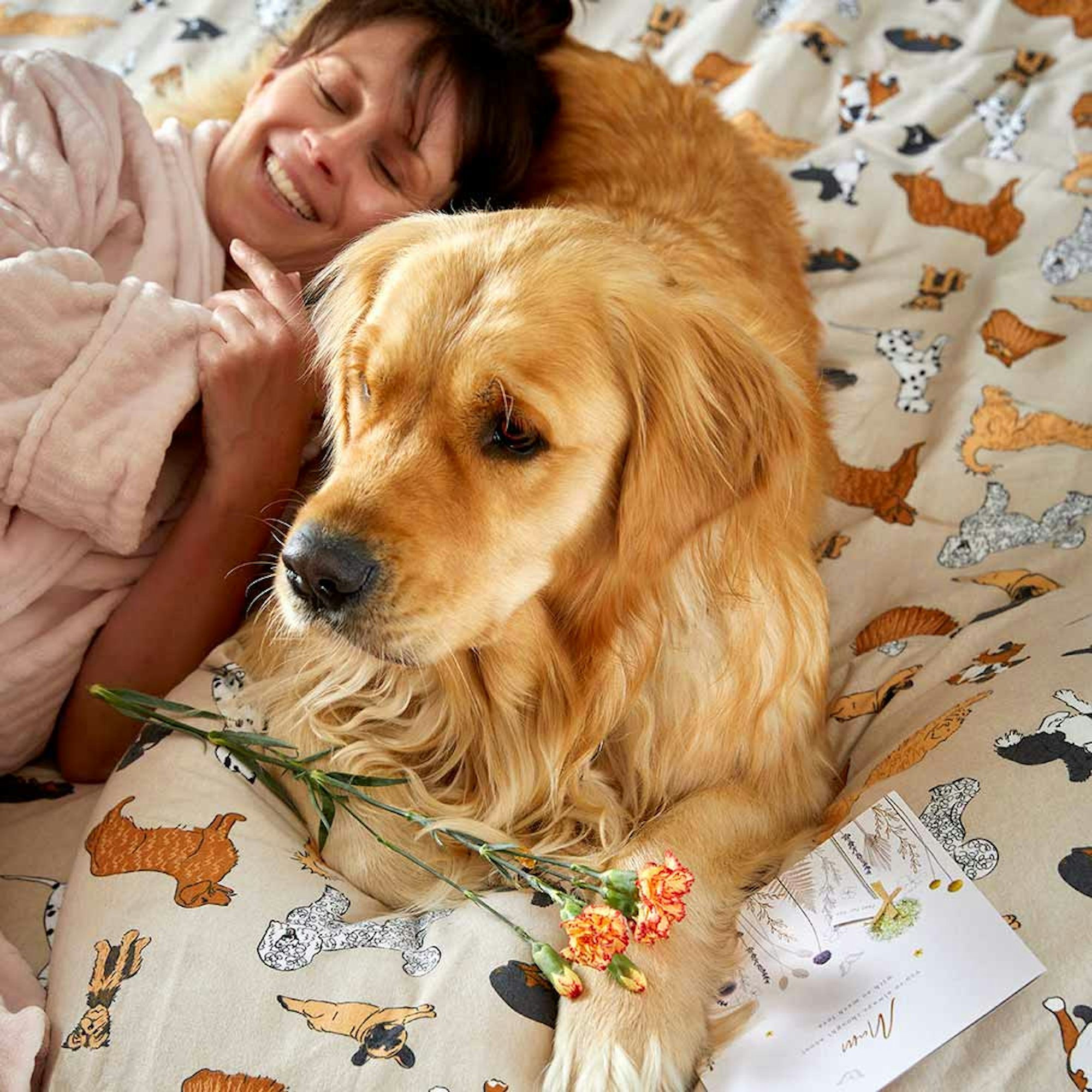 MyHouse Printed Dogs Flannelette Sheet Set. Mother's day Gift guide. Mum lying on bed with dog.