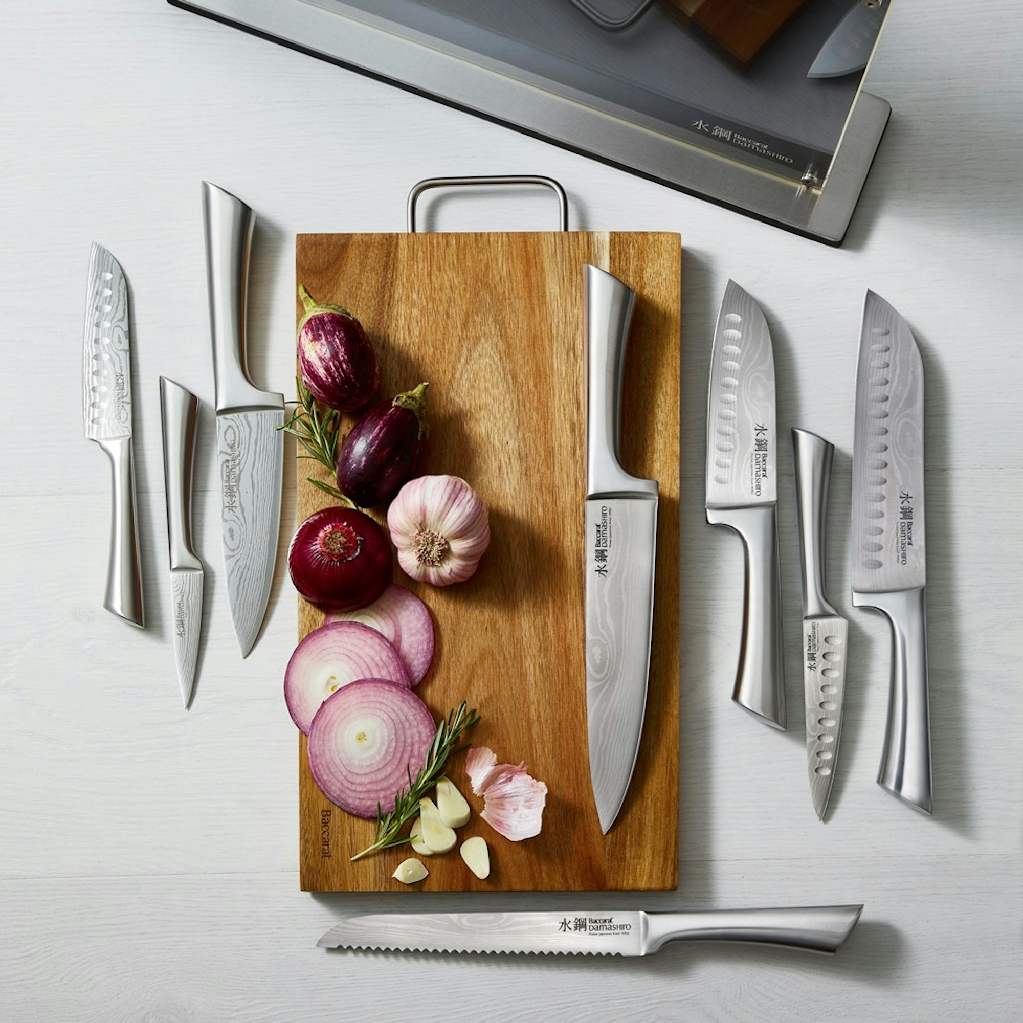 knife set flat lay with onions