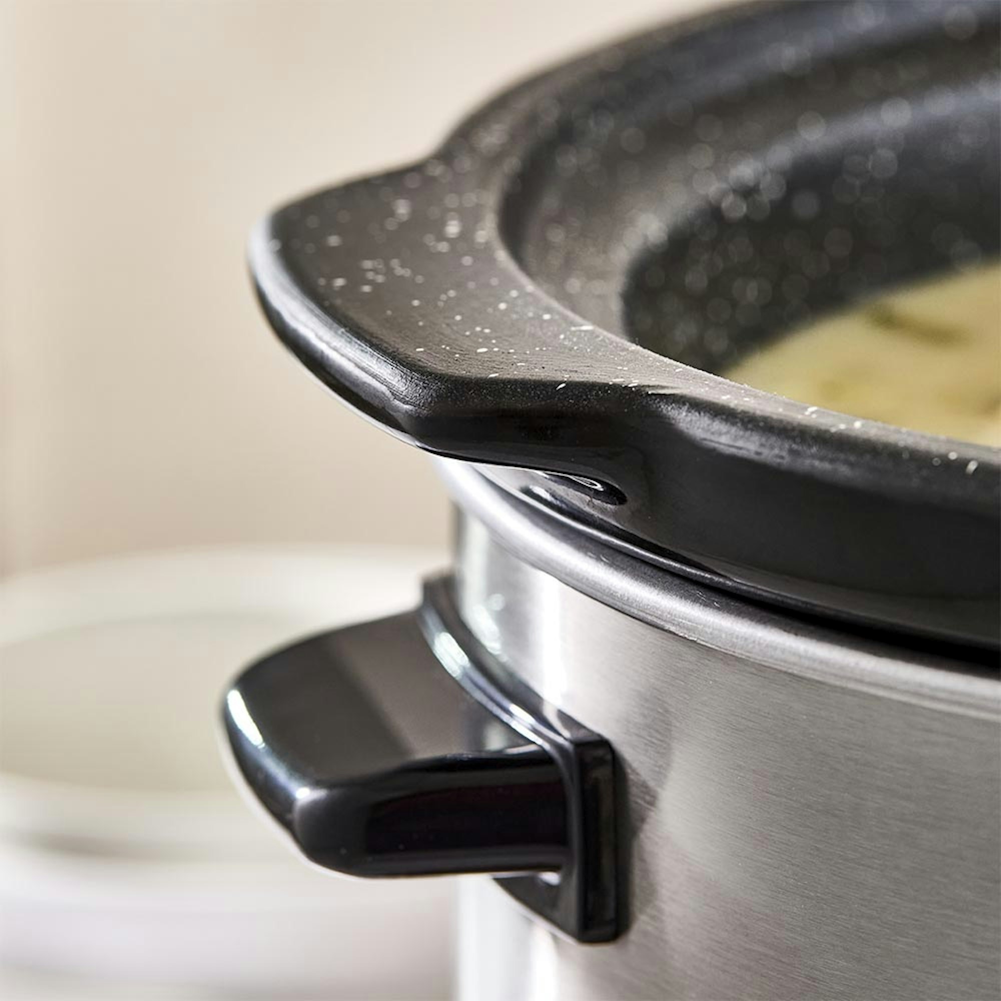 Close up of slow cooker handles. Which is the best slow cooker blog at House.