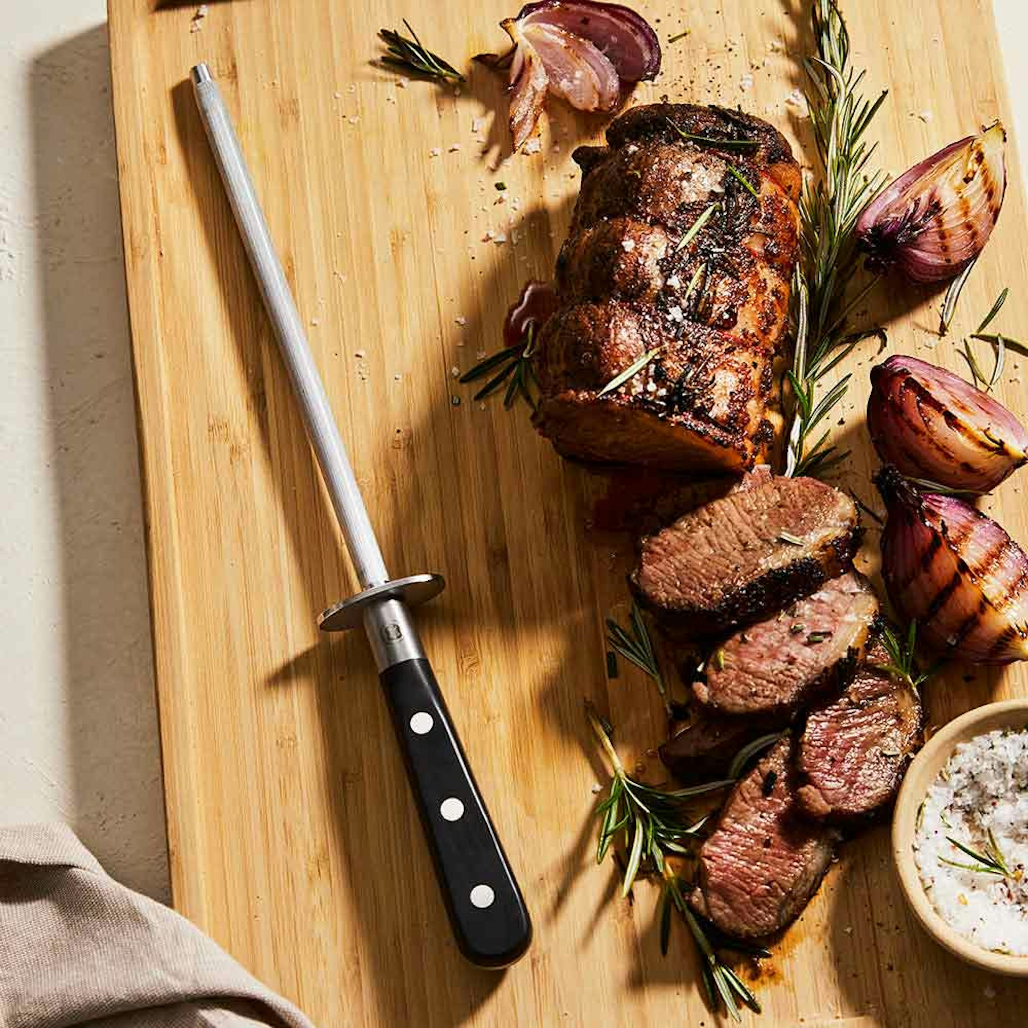 Sharpening steel on wooden chopping board - How to Sharpen a Knife House Blog