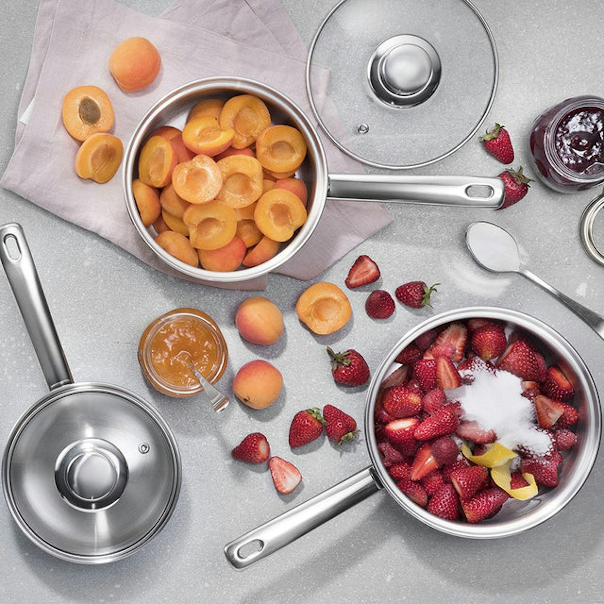 Stainless Steel induction cookware with apricots and strawberries