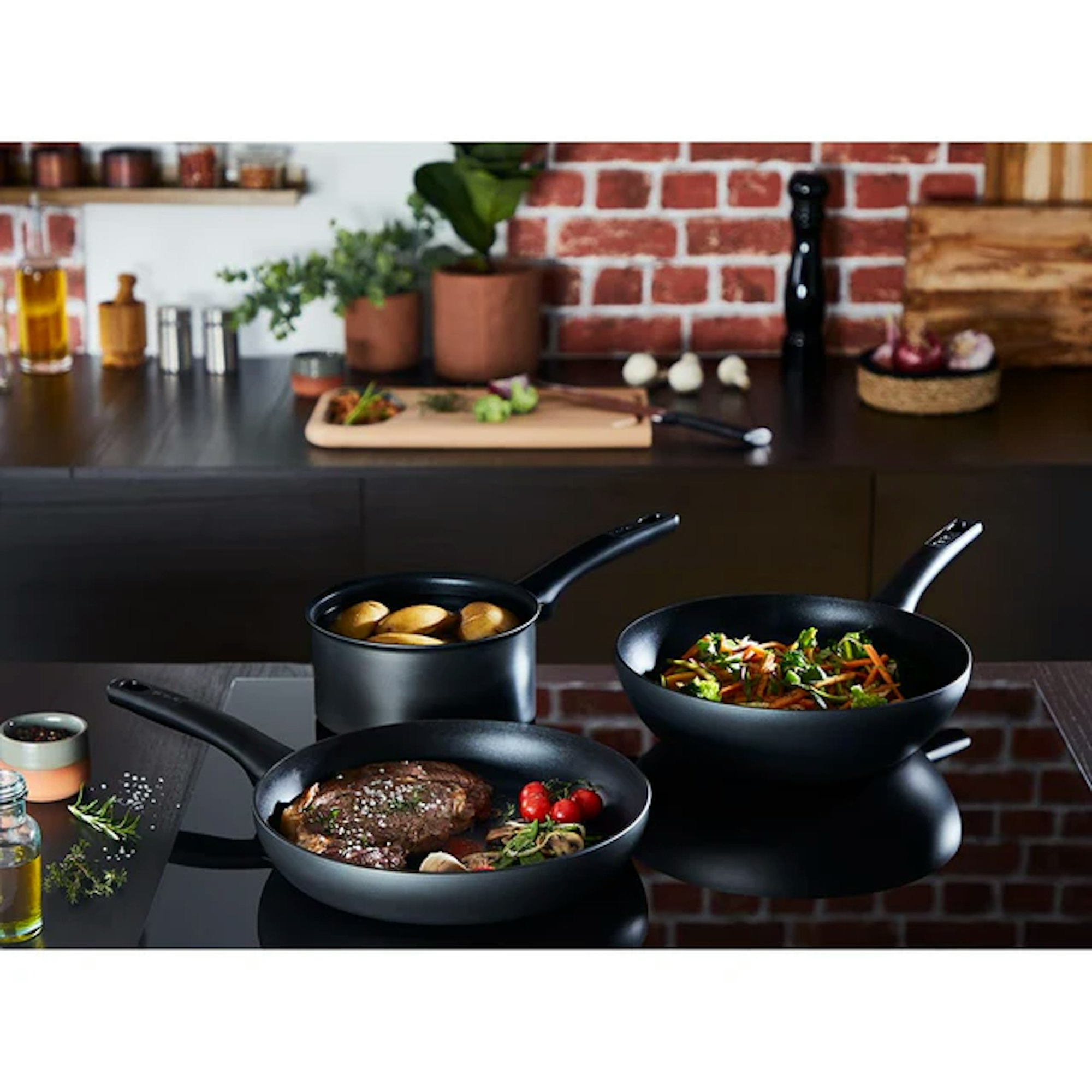 Tefal induction cookware with food being cooked