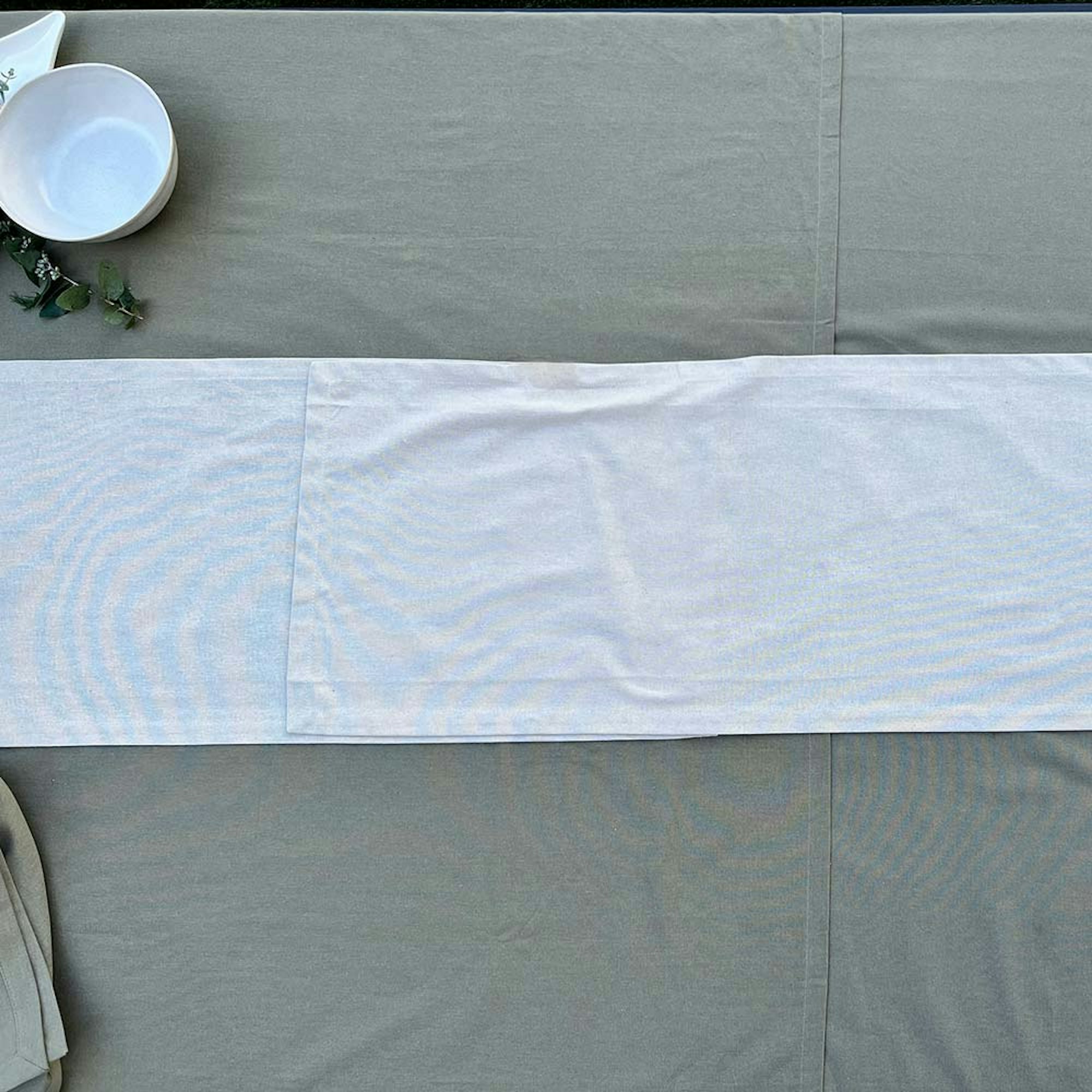 How to style a dining table for a dinner party. Step 2 place your tablecloth and runner. Empty table with table cloth and runner.