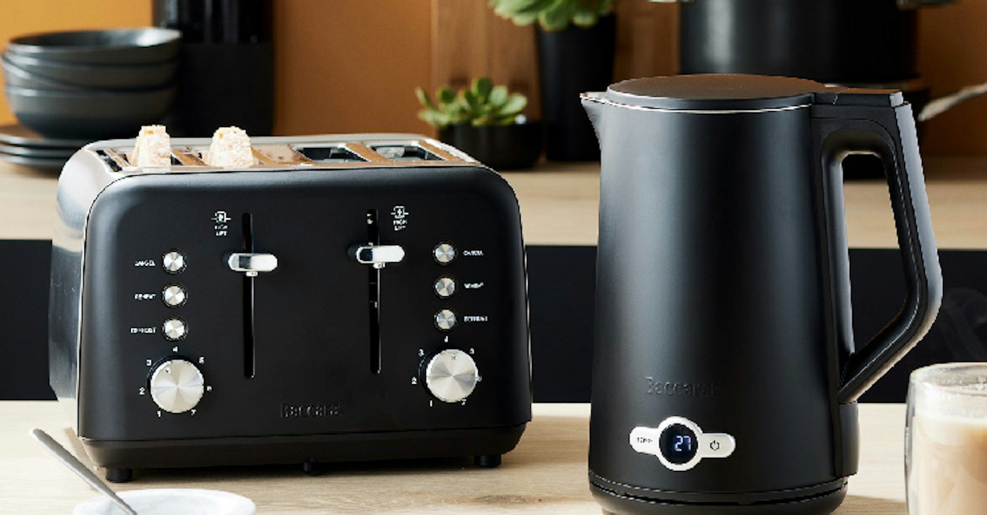 Black toaster and kettle on a kitchen benchtoip