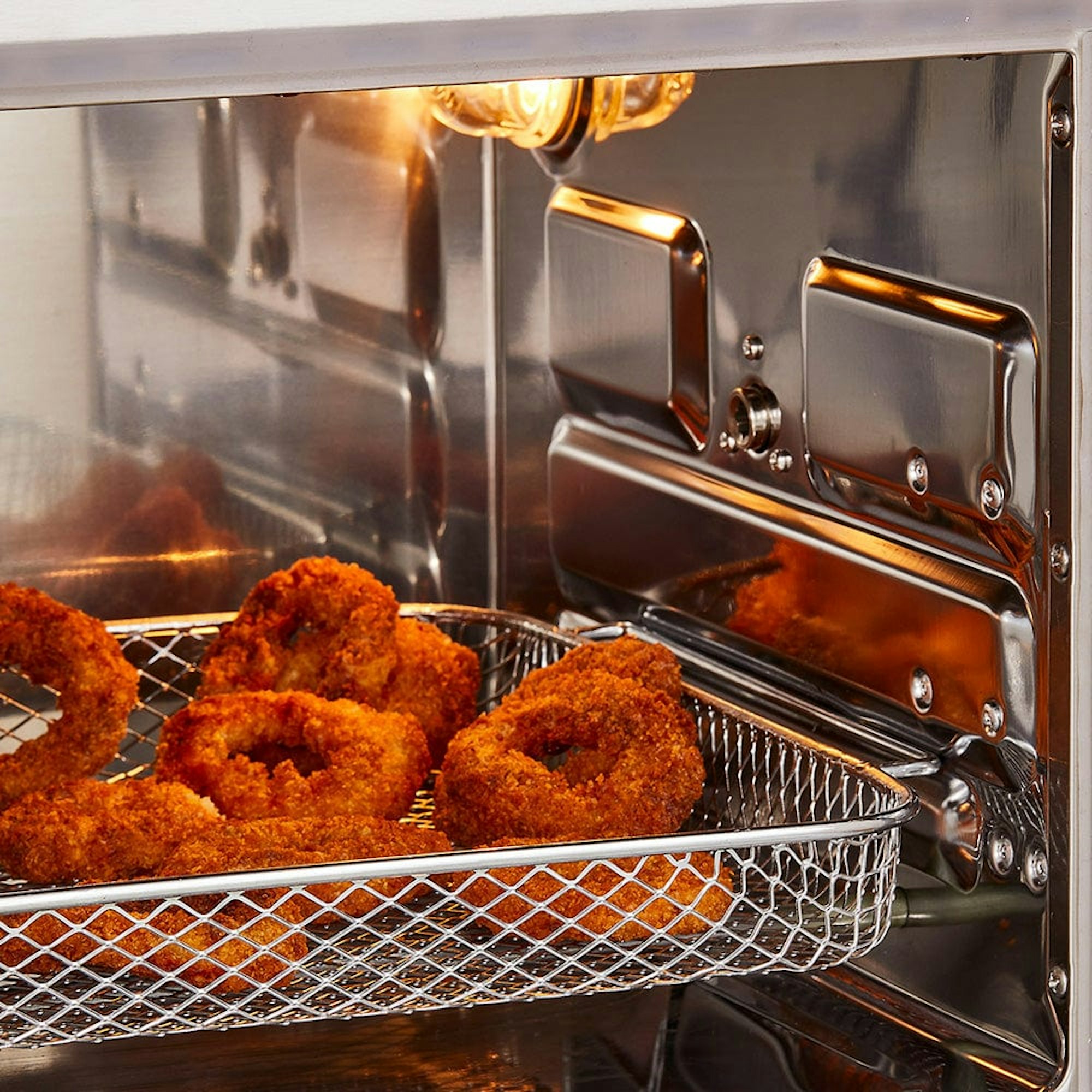 Baccarat The Ultimate Fry XL Air fryer Oven with onion rings