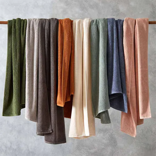 bathroom showing towels stacked on top of each other