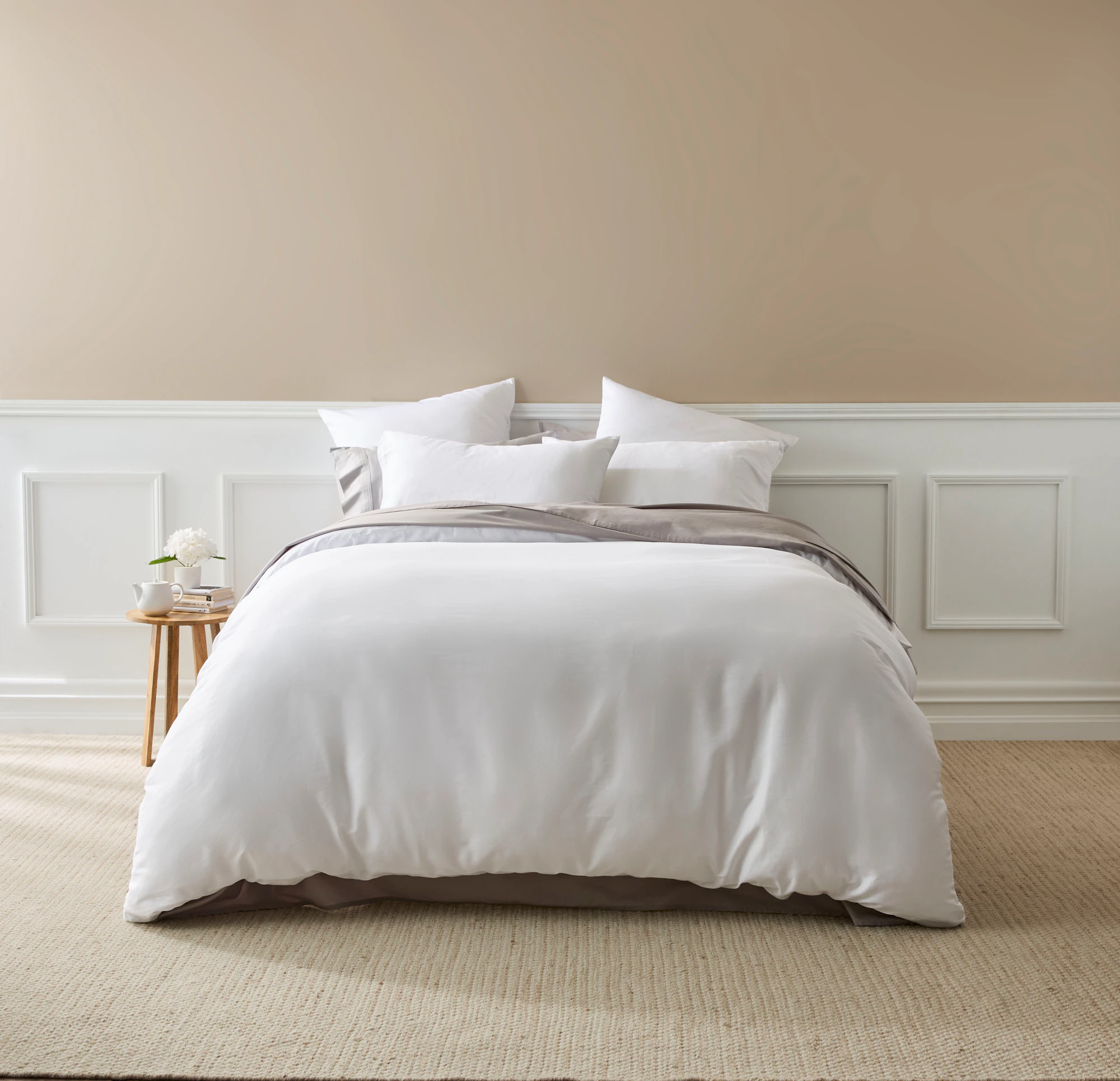 MyHouse Ashton Quilt Cover Set in white cotton sateen, styled on a neatly made bed with matching pillowcases in a neutral bedroom setting