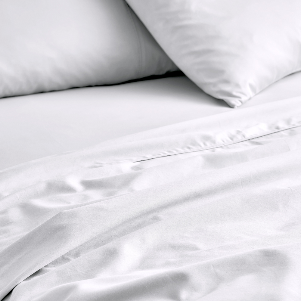 MyHouse Egyptian Cotton Sheet Set in white, featuring smooth cotton sheets and matching pillowcases layered on a neatly made bed