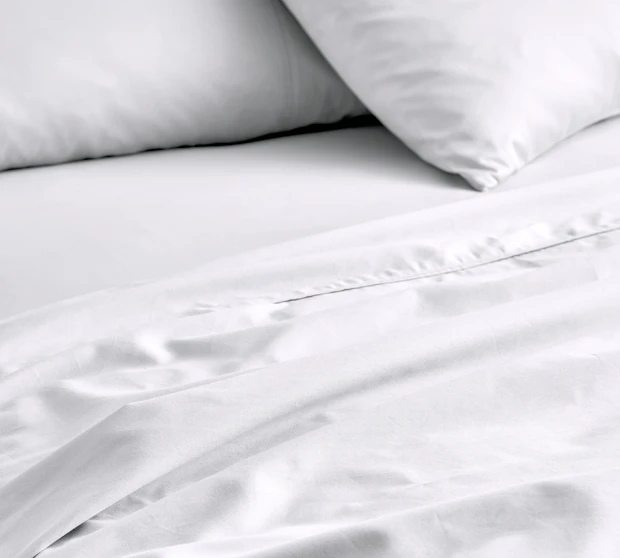 MyHouse Egyptian Cotton Sheet Set in white, featuring smooth cotton sheets and matching pillowcases layered on a neatly made bed