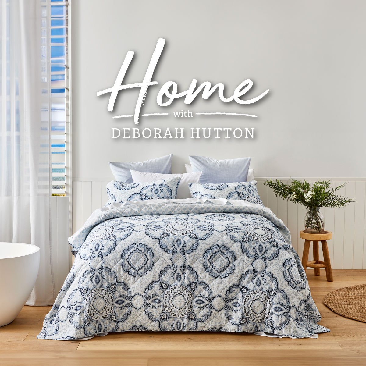 Deborah Hutton quilt cover set with grey ornamental pattern styled on a bed in a neutral bedroom setting Provide your feedback on BizChat