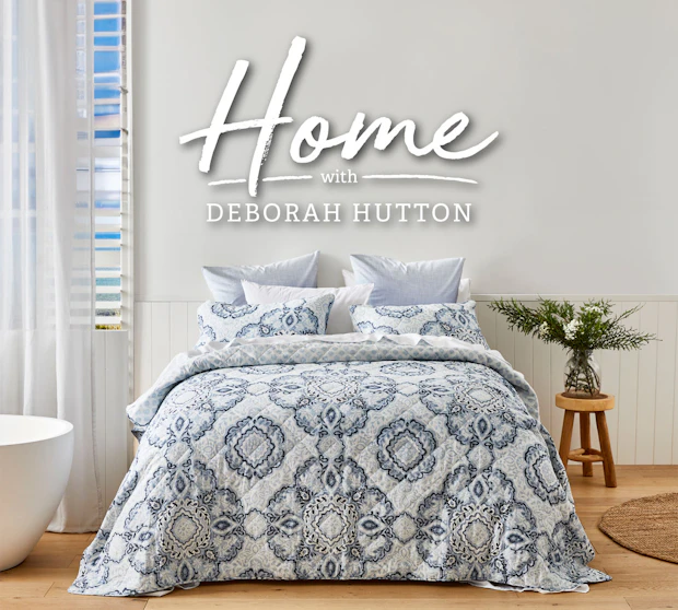 Deborah Hutton quilt cover set with grey ornamental pattern styled on a bed in a neutral bedroom setting Provide your feedback on BizChat