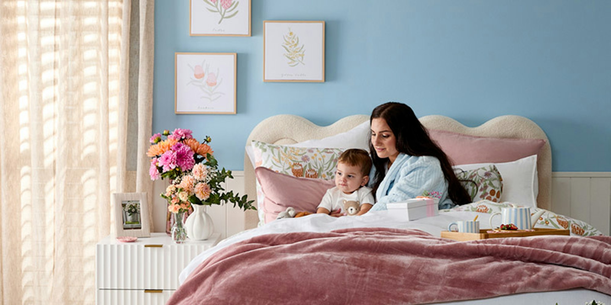 Mother and son sitting up in bed - gift ideas for her
