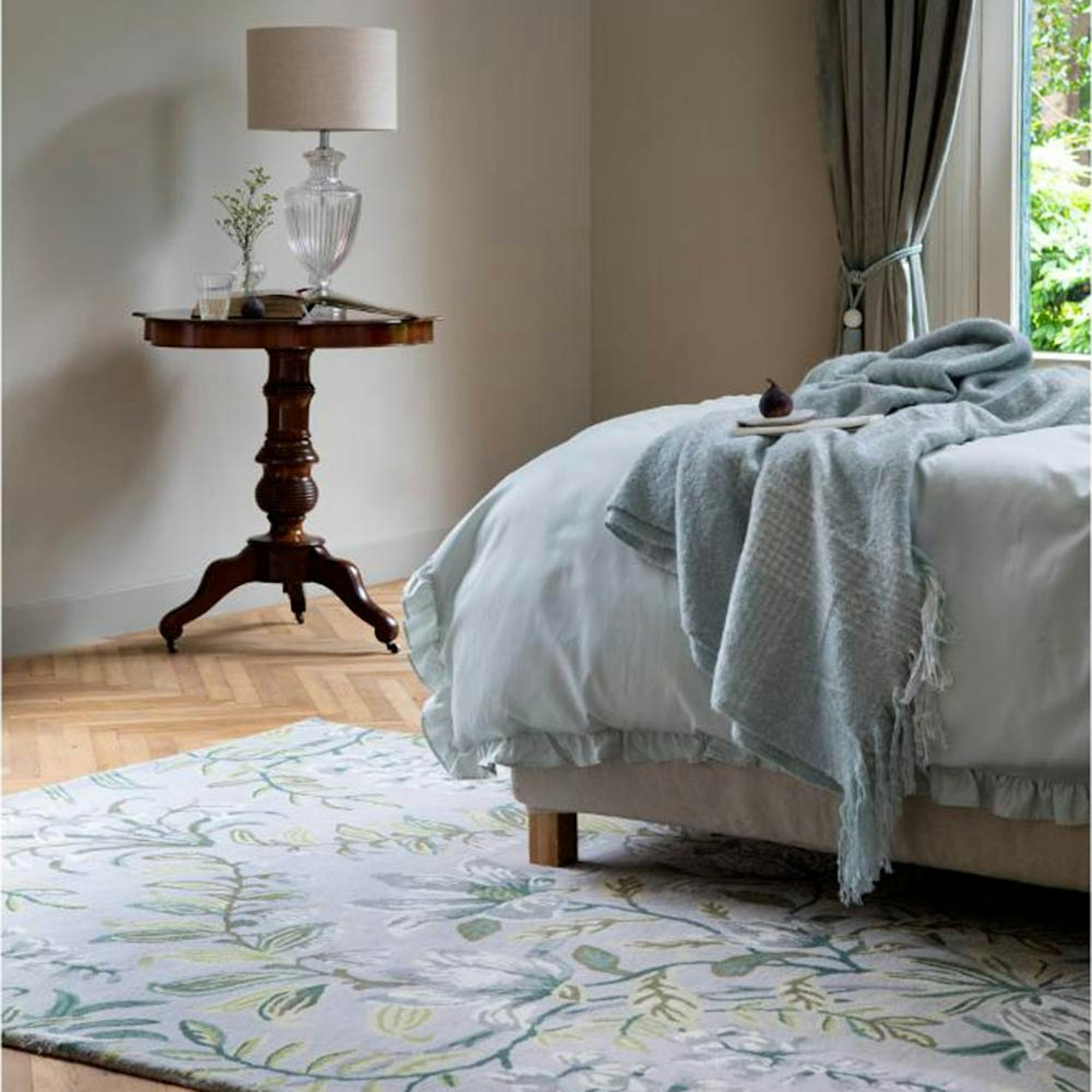 Laura Ashley blue and green floral rug in bedroom - gift ideas for her