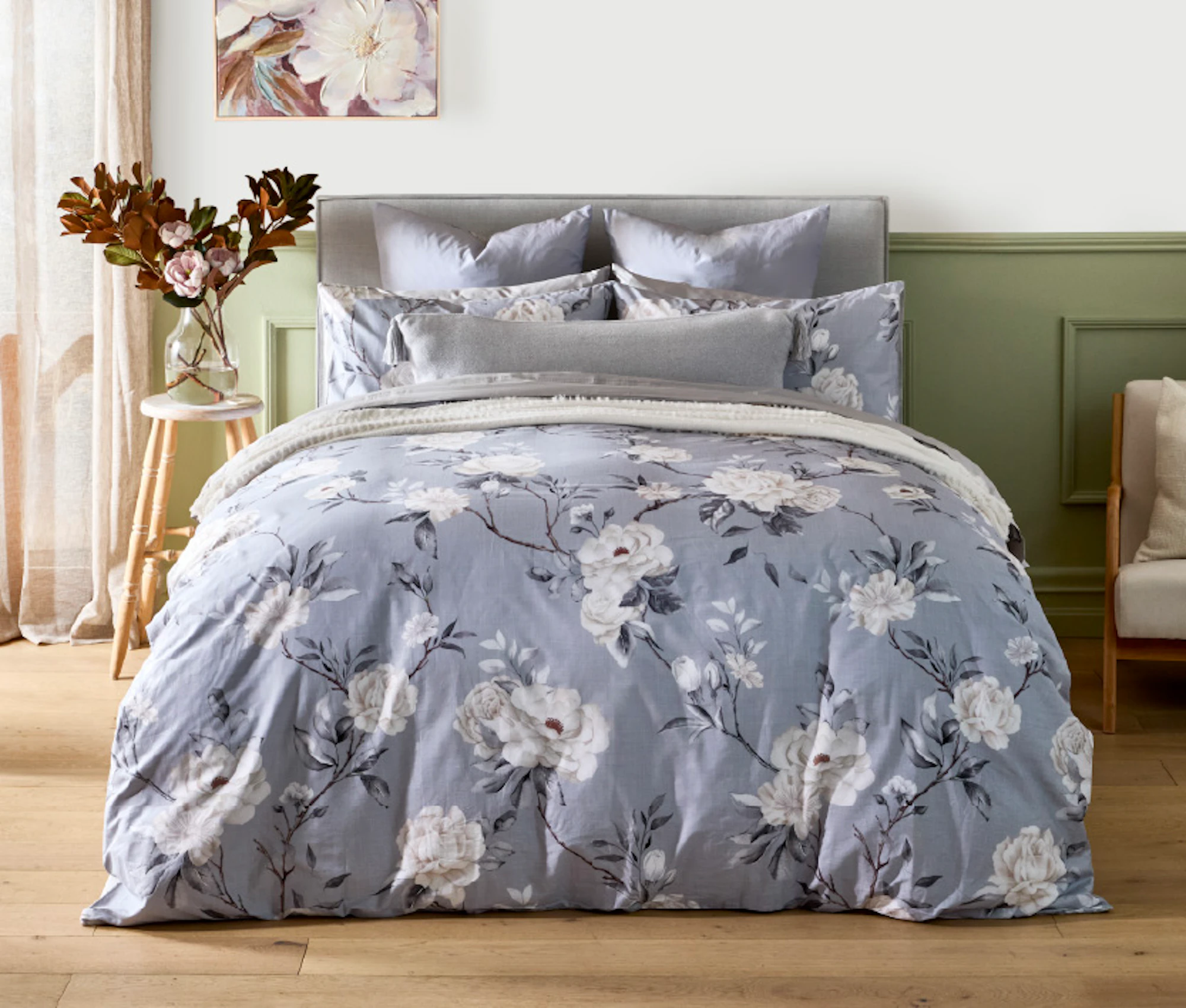 King size bed with grey floral quilt cover and matching pillowcases