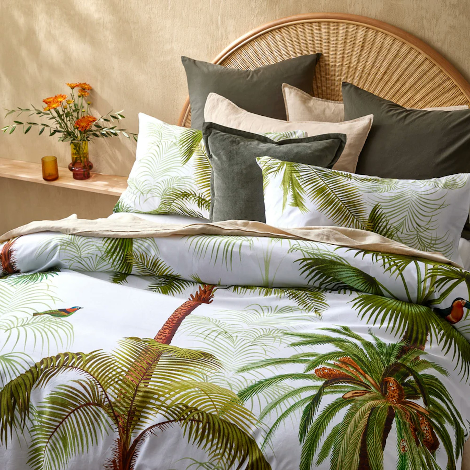 tropical themed bedding in bedroom with pillows