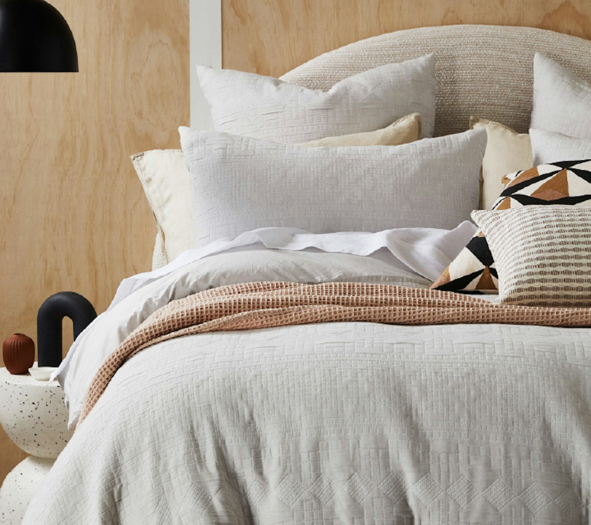 Bedroom pillows arranged on a nicely decorated bed