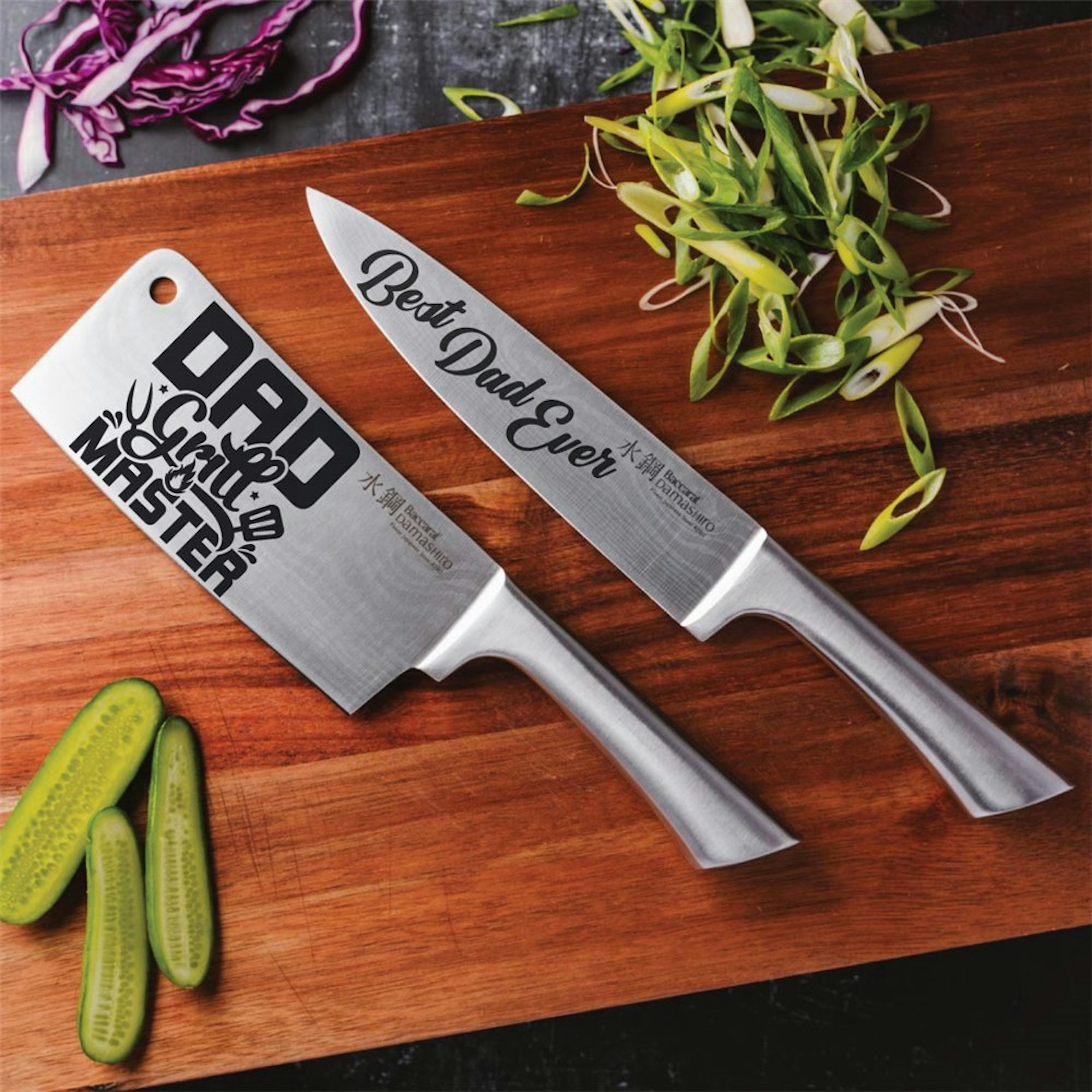 Father's day gift guide. Best dad ever chef knife and dad the grill master cleaver flat lay on a chopping board