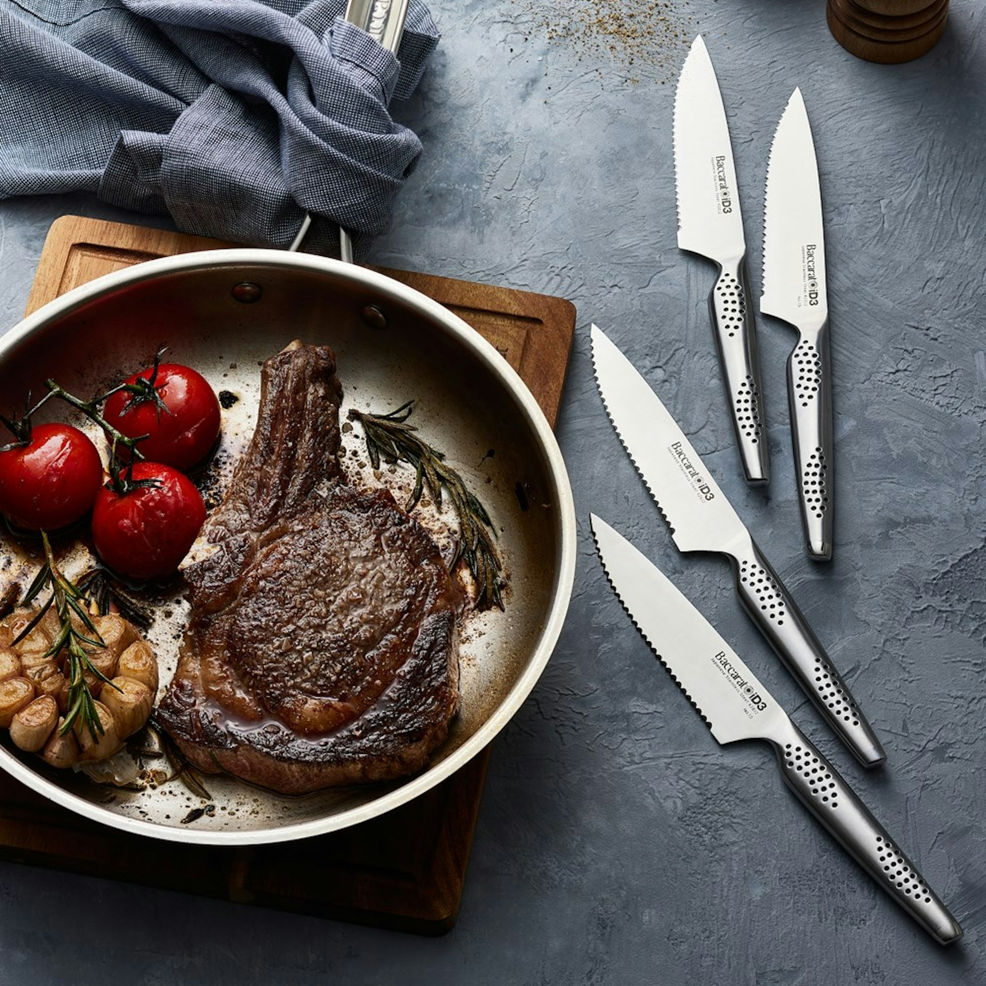 reverse sear steak in pan with tomato and garlic