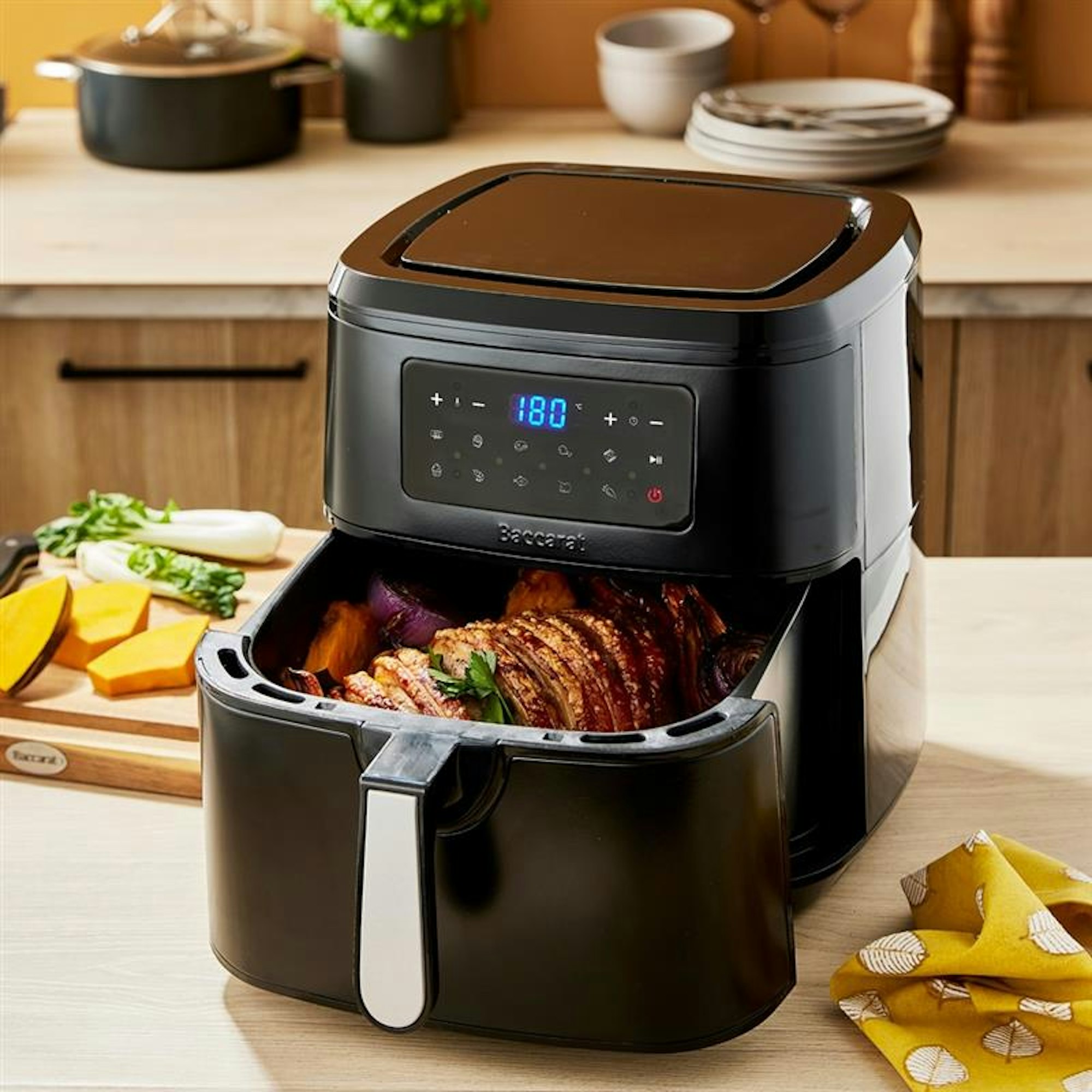 Black air fryer with roast pork