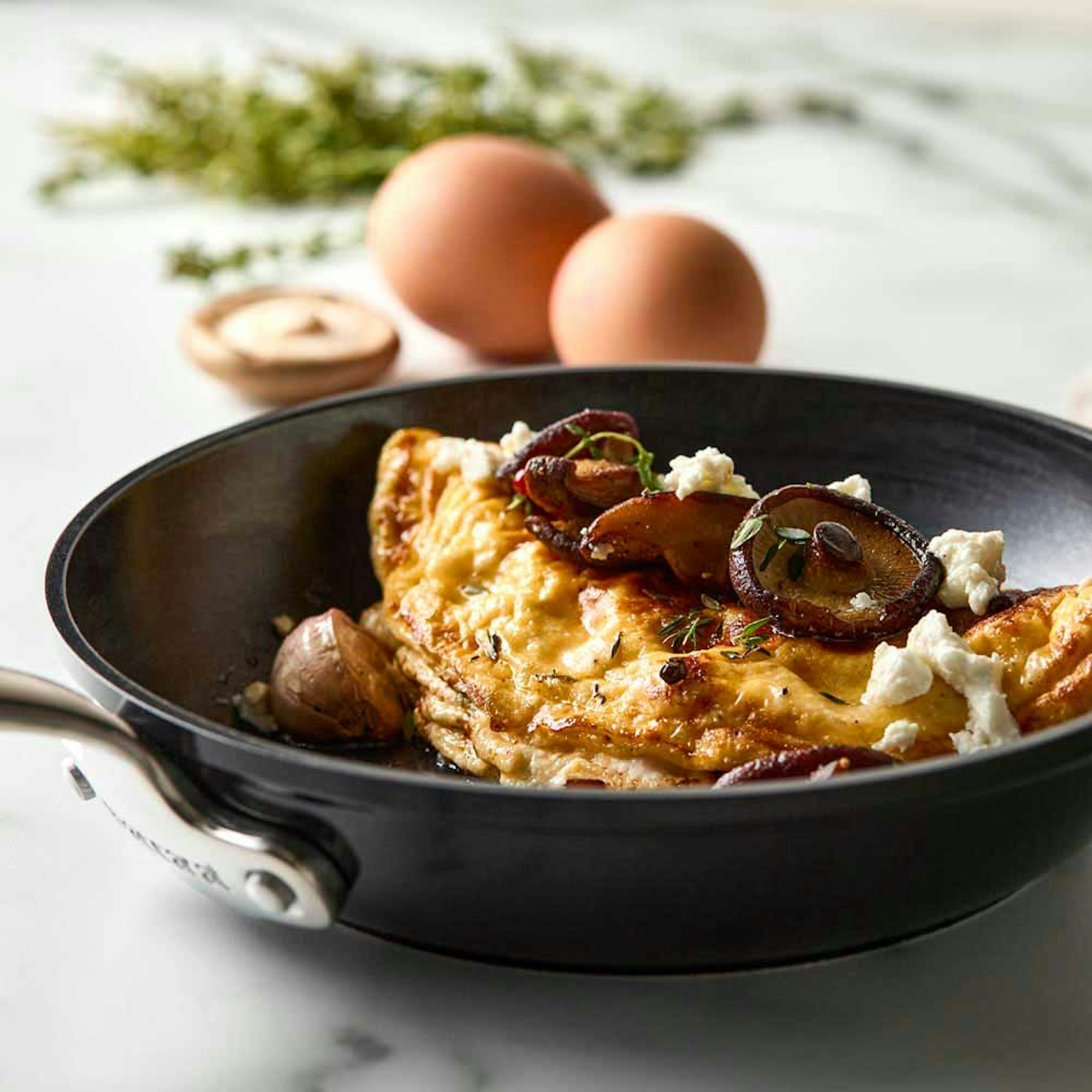 Eggs, mushroom, and feta in non stick frypan - What Size Fry Pan Do I Need blog