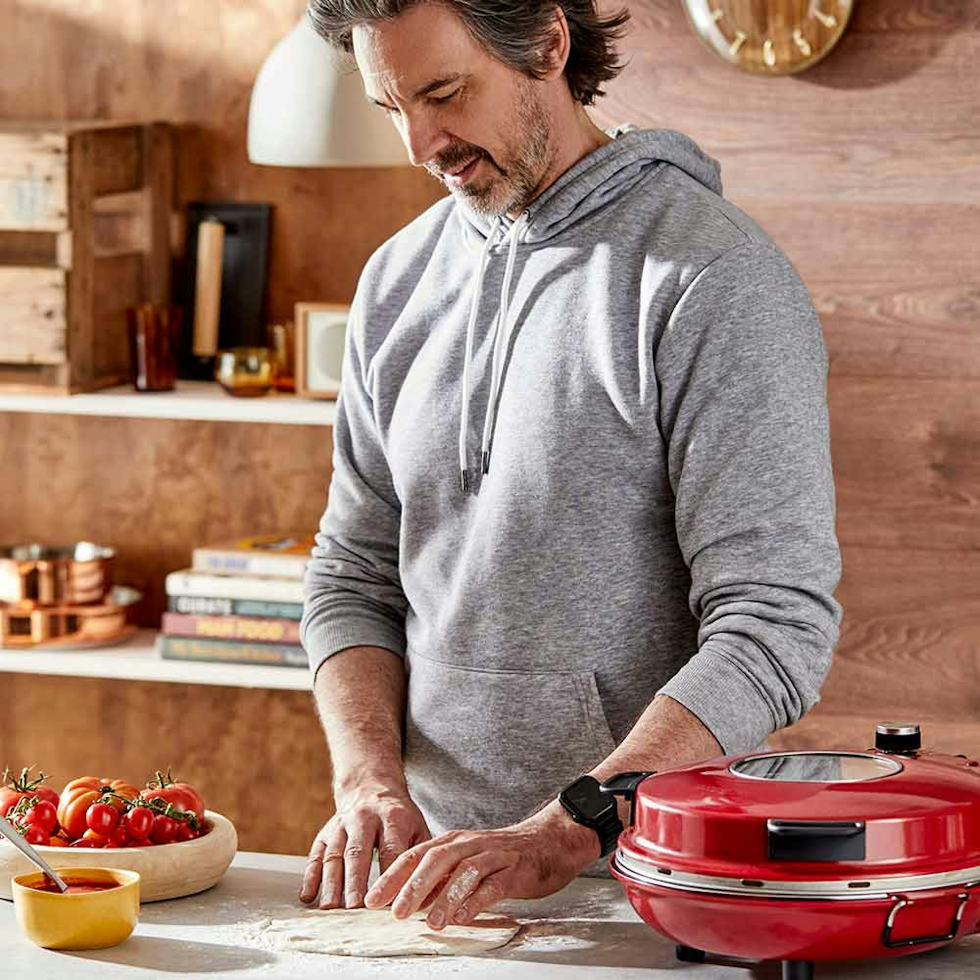 How to use a pizza stone? man preparing pizza dough