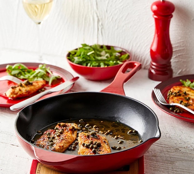 Chicken being cooked on frypan