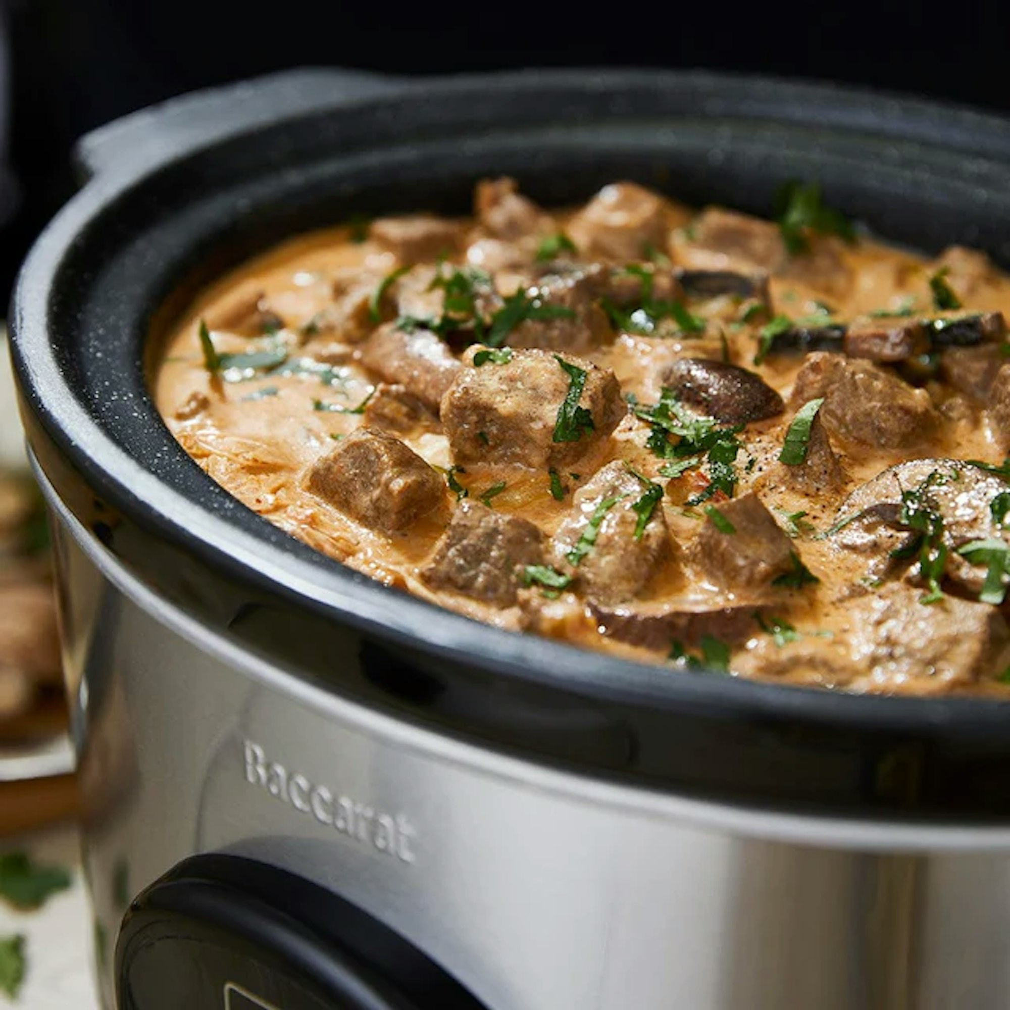 slow cooker with cooked stew