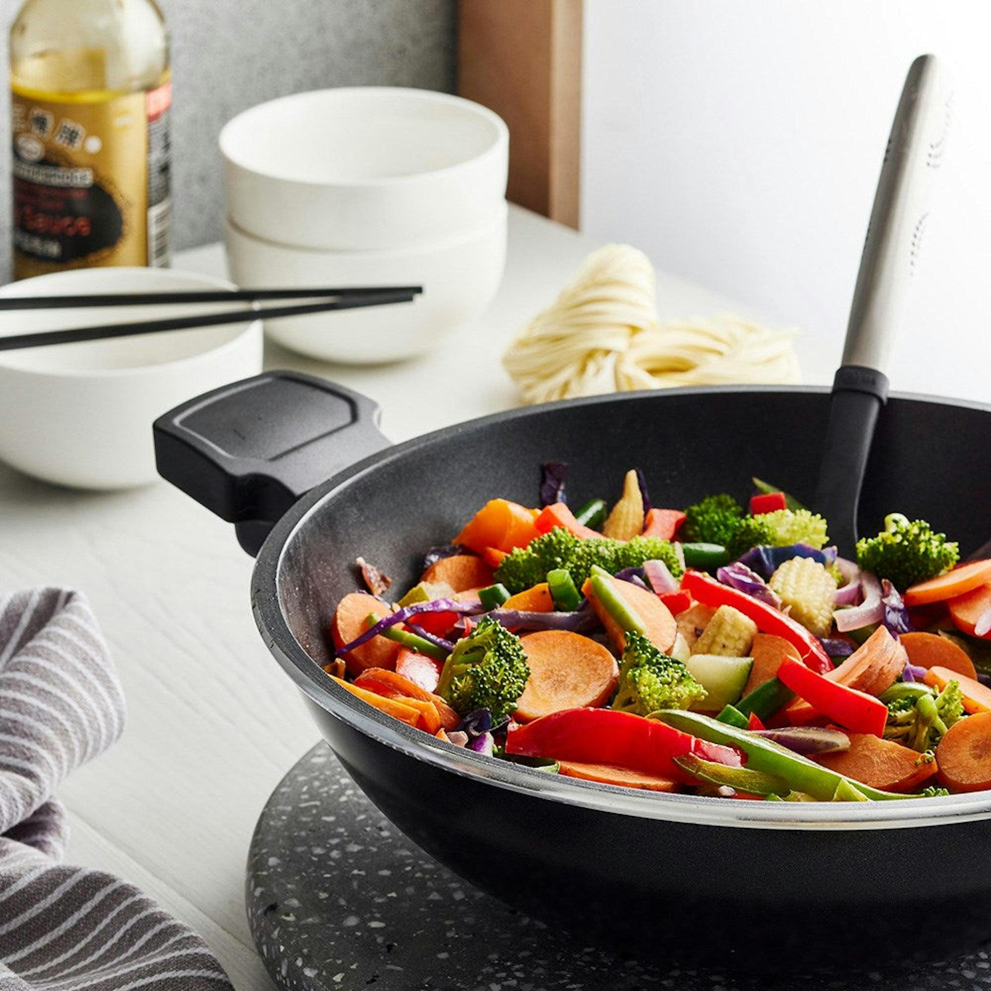 How to Master Stir-frying? Robins Kitchen Blog - In The Kitchen. Vegetable stir fry in non stick wok by the window.