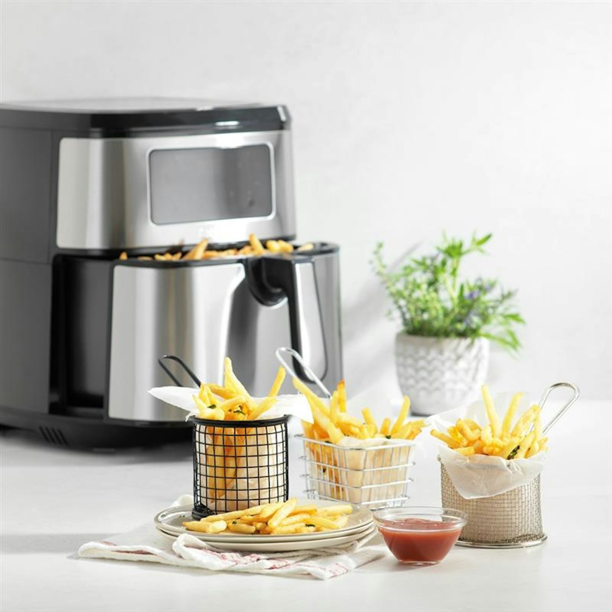 Silver air fryer with chips