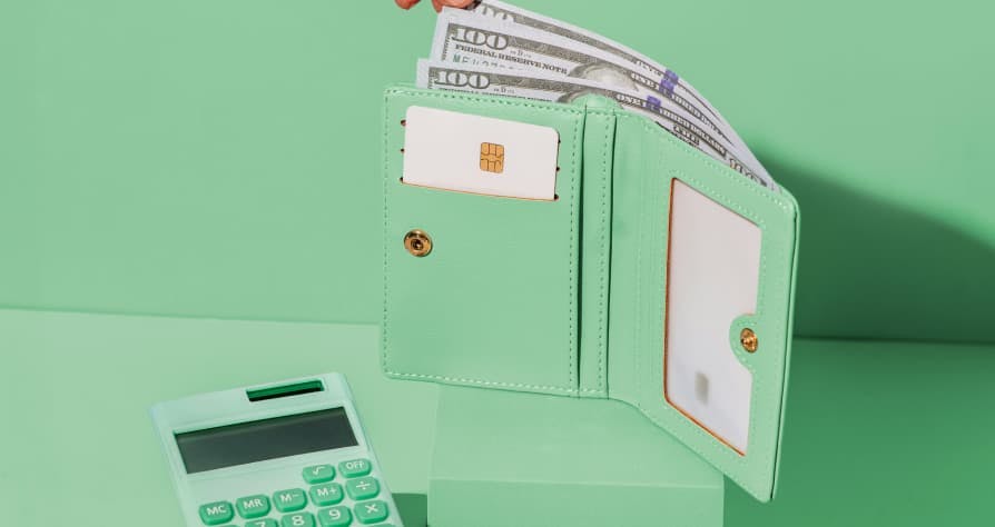 green wallet with green calculator